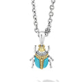 A LAGOS exclusive. Turquoise with diamond, 18K gold and sterling silver accents forming a beetle pendant.