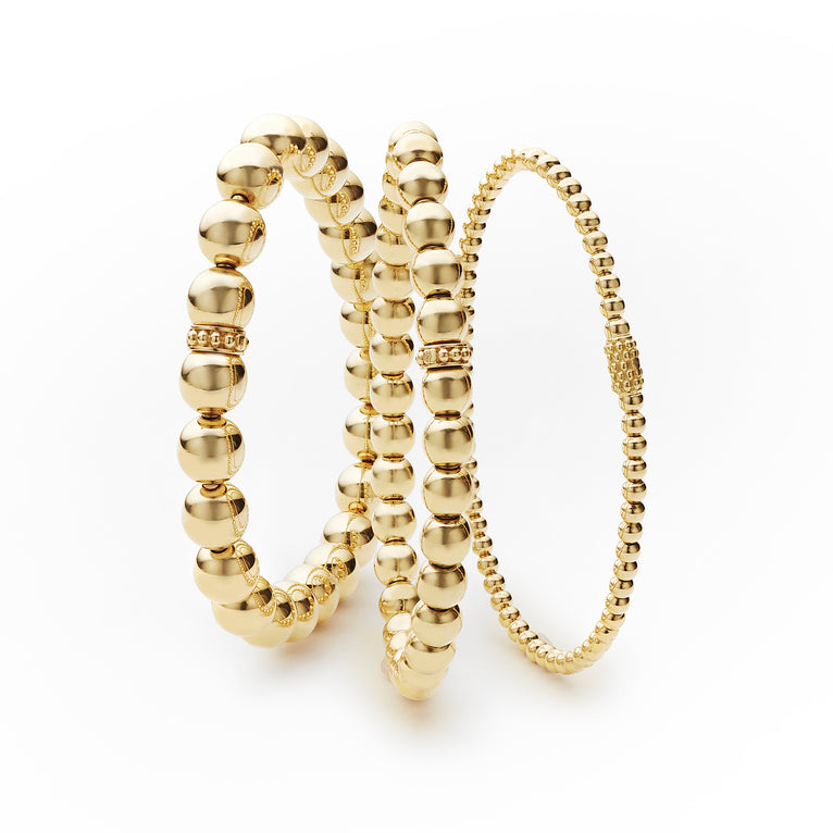 Three 18K gold signature Caviar beaded bracelets from our Caviar Gold collection. 18K Gold Slip On Style Stretch fit accommodates most wrist sizes Bracelets displayed in 3mm, 6mm, and 8mm