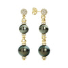 Suspended from a diamond Caviar beaded ball, each earring showcases two captivating black Tahitian pearls. These drop earrings combine the brilliance of diamonds with the iridescent glow of pearls.