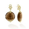 These drop earrings feature beautifully faceted smokey quartz gemstones, set in 18K gold framing. Each gemstone is adorned with sparkling diamonds.