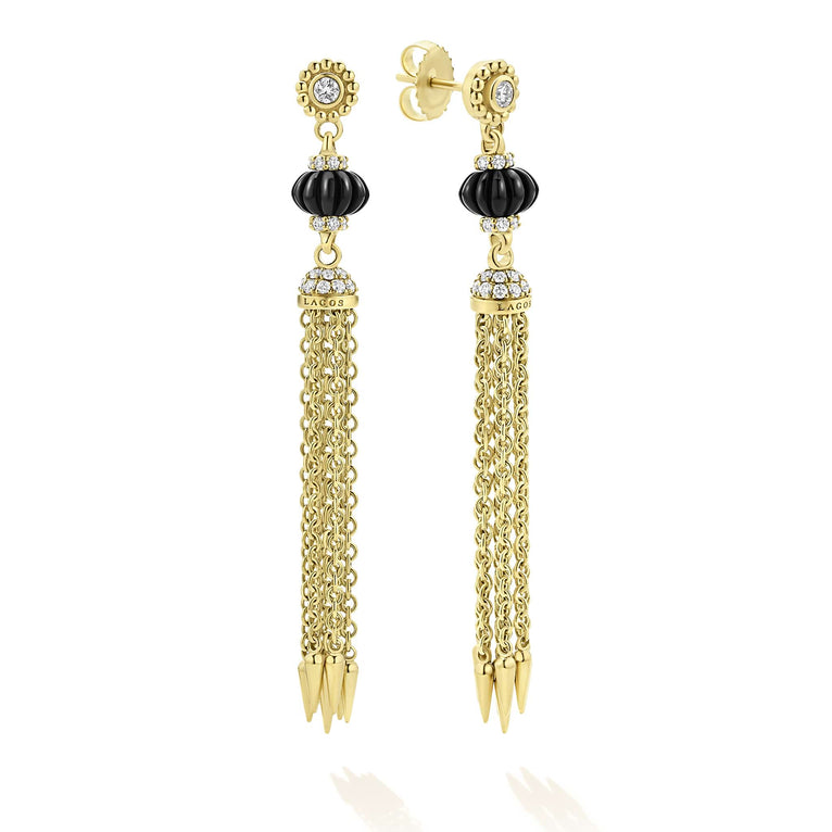 Featuring hand carved pumpkin beads set in pavé diamonds, these earrings are finished with delicate 18k gold chains with Black Agate details. Ideal for those seeking bold yet timeless style.