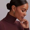 Woman wearing 18K Gold and Black Ceramic Link Drop Earrings