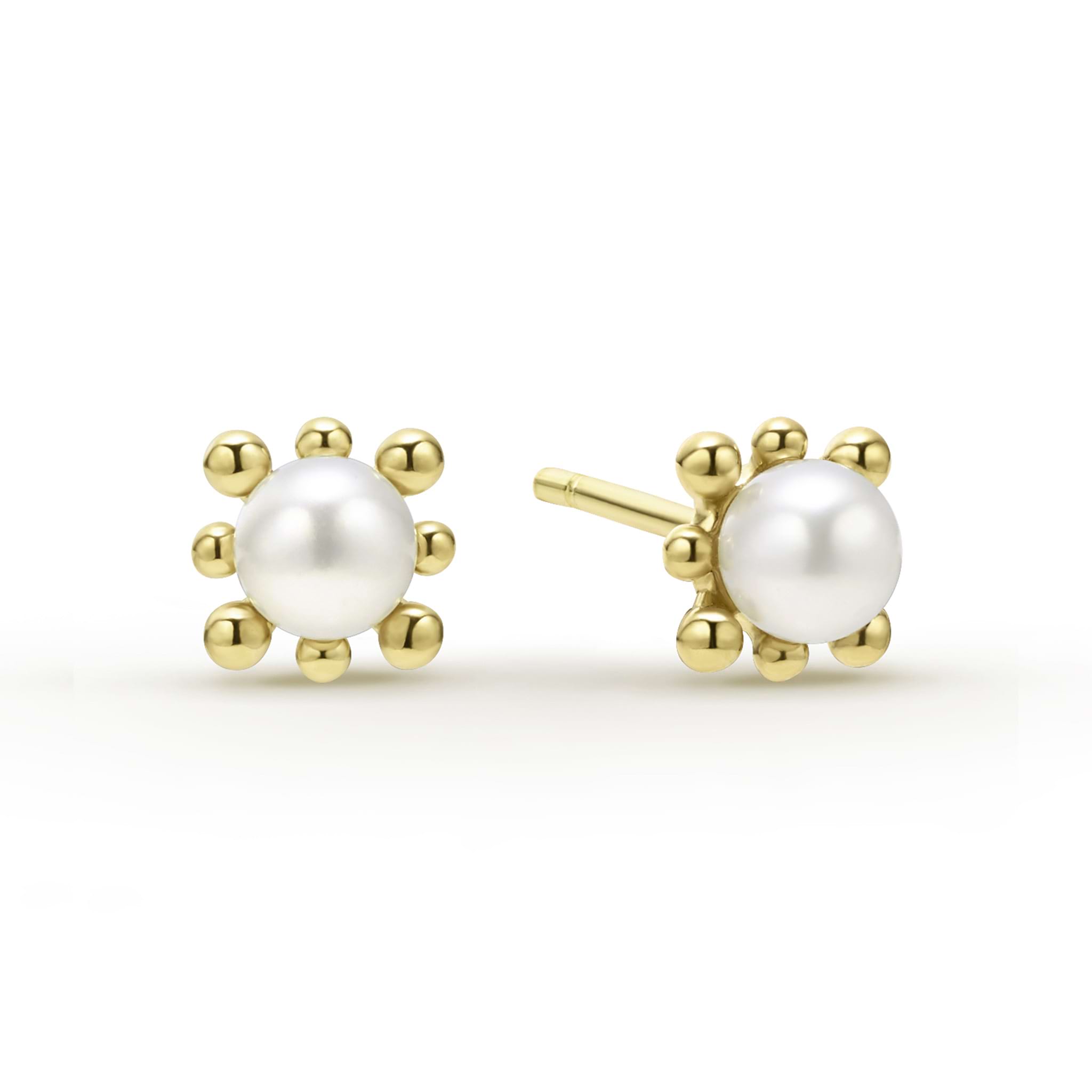 Sophisticated cultured freshwater pearl earrings framed by fleurs of 18K gold.