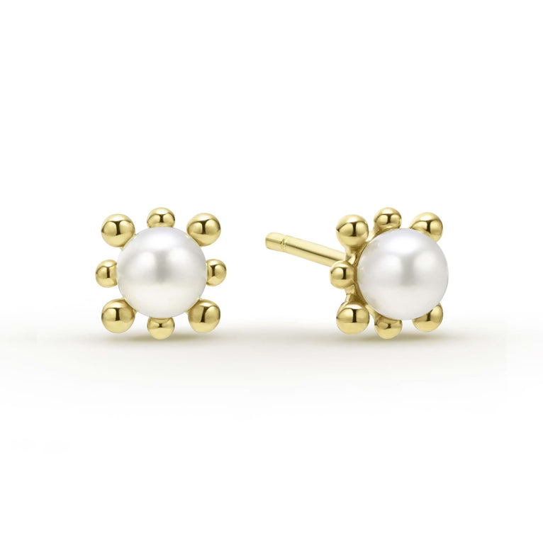 Sophisticated cultured freshwater pearl earrings framed by fleurs of 18K gold.