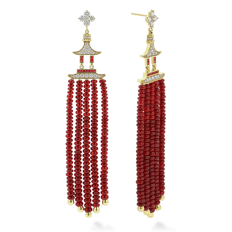 Ruby gemstones surrounded by smooth 18K gold and diamonds form these dramatic tassel drop earrings. LAGOS diamonds are the highest quality natural stones.