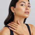 Woman wearing Small 18K Gold and Black Ceramic Diamond Link Drop Earrings