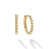 18K gold Caviar beading form these signature huggie earrings.