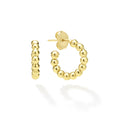 Gold hoop earrings on a white background