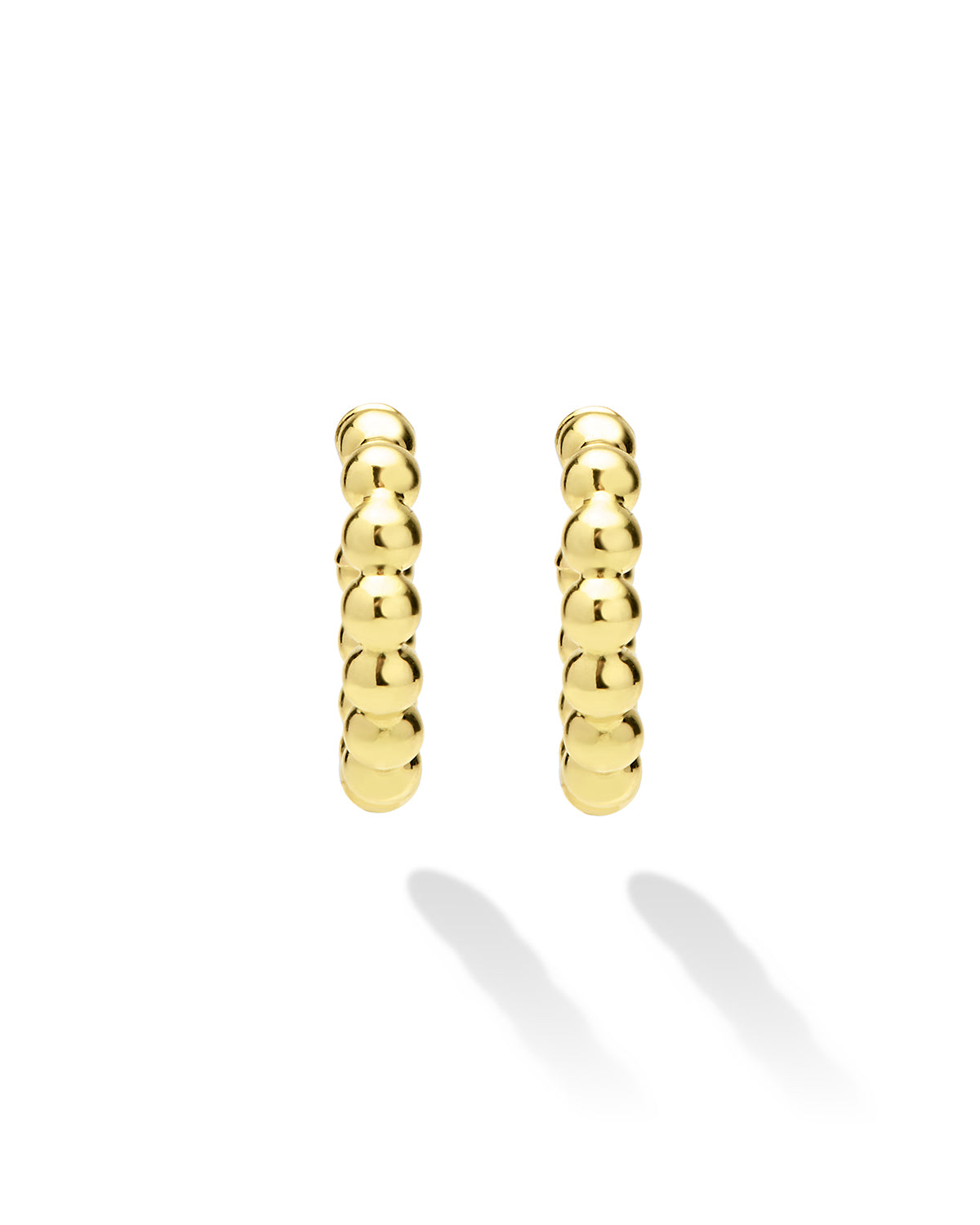 Pair of gold hoop earrings on a white background