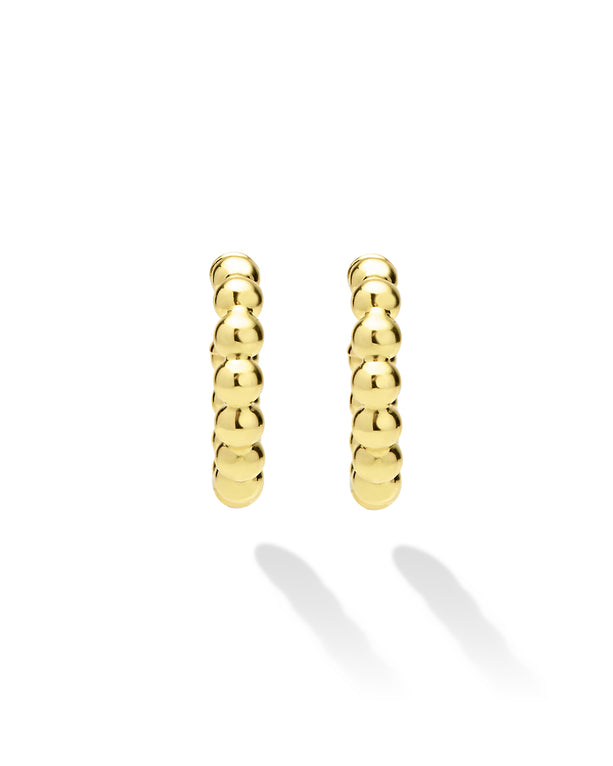Pair of gold hoop earrings on a white background