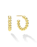 Gold hoop earrings with bead detailing on a white background