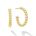 Gold hoop earrings on a white background