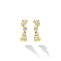 18K Gold huggie earrings with bezel-set diamonds on white background 
