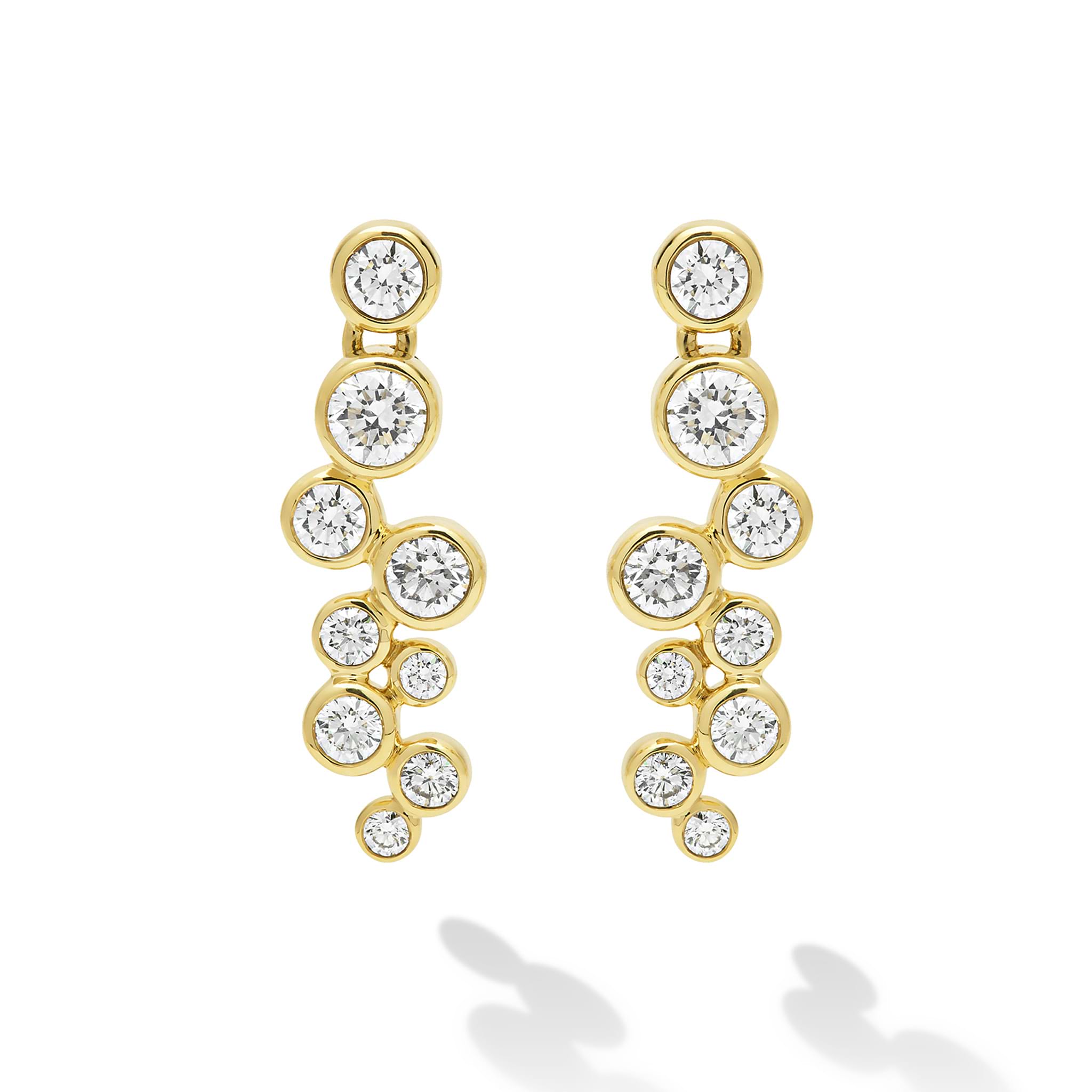 Nine diamonds drop earrings set in gold  on a white background