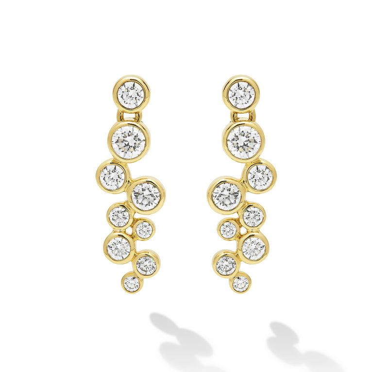 Nine diamonds drop earrings set in gold  on a white background