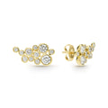 Eleven bezel-cut diamond stud earrings set in 18K gold with friction back closure on a white background