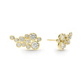 Eleven bezel-cut diamond stud earrings set in 18K gold with post on a white background