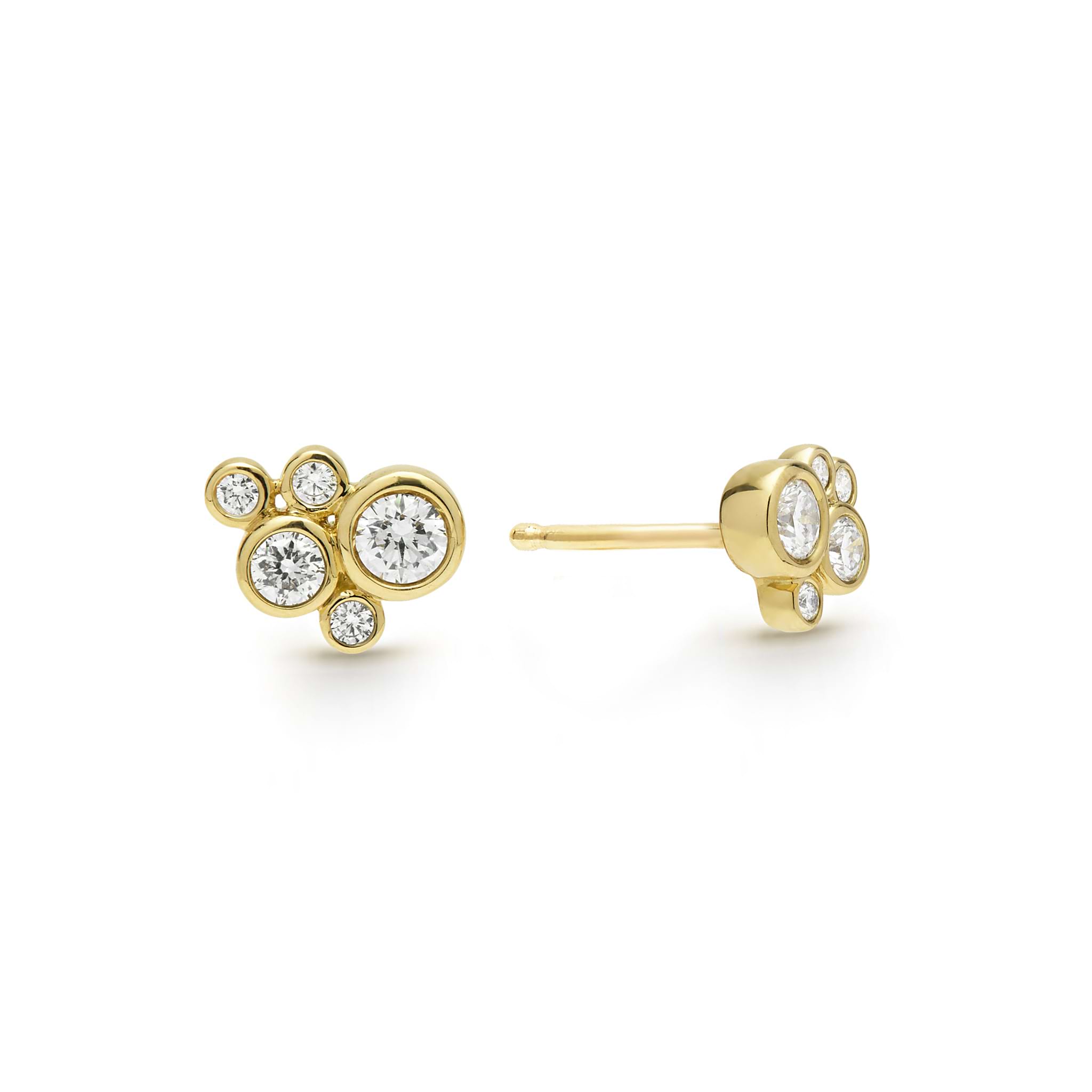 Five bezel-cut diamond stud earrings set in 18K gold with post on a white background