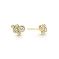 Five bezel-cut diamond stud earrings set in 18K gold with post on a white background