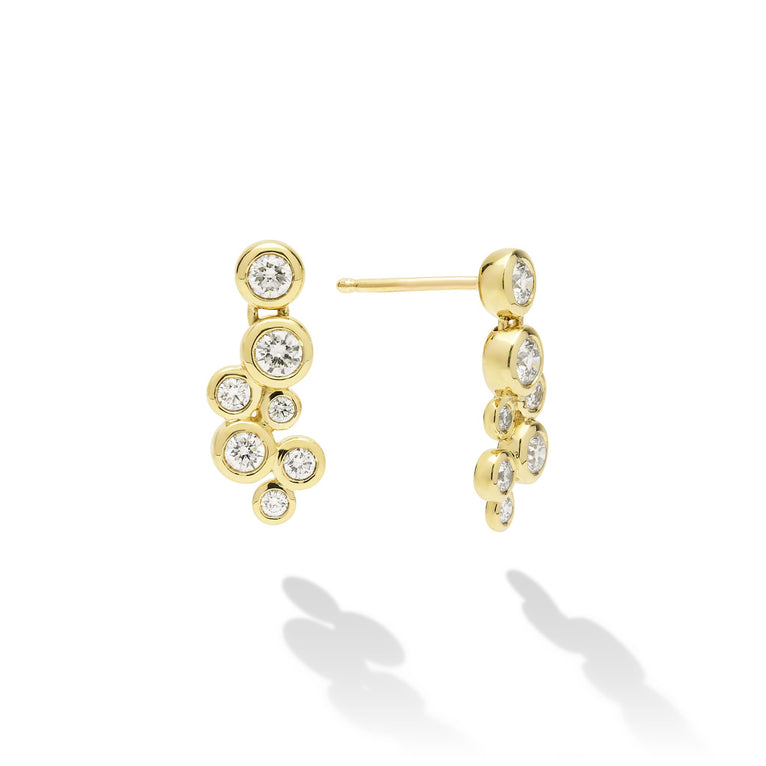 Seven diamonds drop earrings set in gold with friction back on a white background