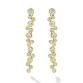 Seventeen bezel-cut diamond drop earrings set in 18K gold on a white background
