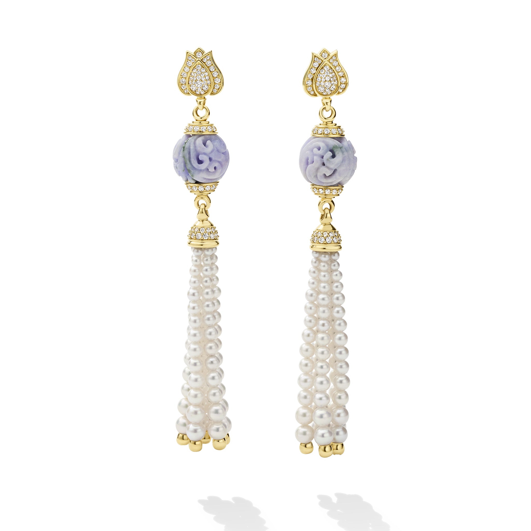 Pair of earrings with gold accents, purple gemstones, and pearl tassels on a white background