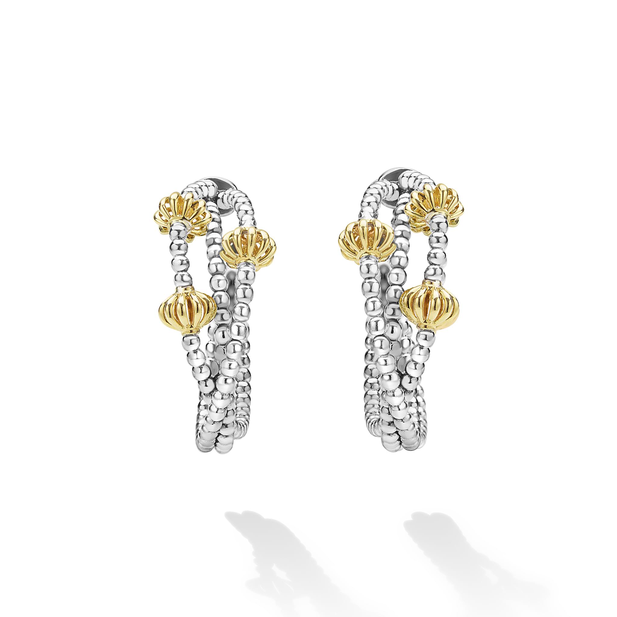 Caviar Icon Sterling Silver & 18K Gold Beaded Triple Hoop Earrings with twisting silver strands and gold bead accents, exemplifying LAGOS elegance and artisanal craftsmanship.