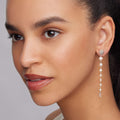 Model wearing linear Pearl Drop Earrings