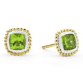Peridot gemstone stud earrings surrounded by smooth sterling silver and 18K gold Caviar beading.
