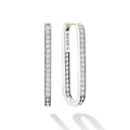 Diamonds surrounded by smooth sterling silver form these statement hoop earrings. LAGOS diamonds are the highest quality natural stones.
