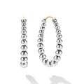 front of oval-shaped sterling silver beaded hoop earrings with LAGOS engraving