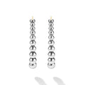 front of oval-shaped sterling silver beaded hoop earrings