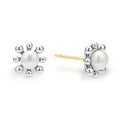 Classic cultured freshwater pearl earrings framed by fleurs of sterling silver. Just the right touch for every day.