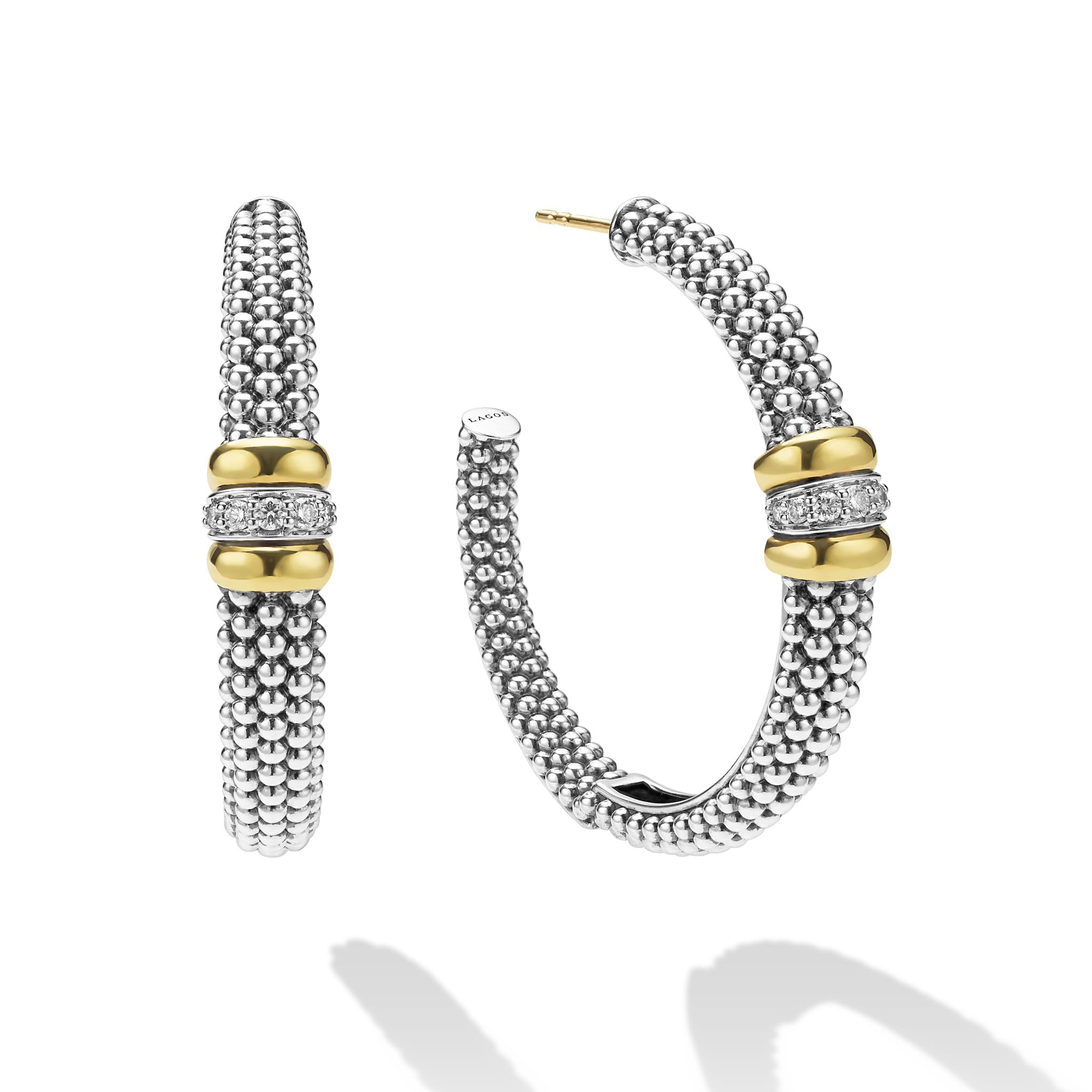 side of large sterling silver beaded hoop earrings with gold and diamond accents