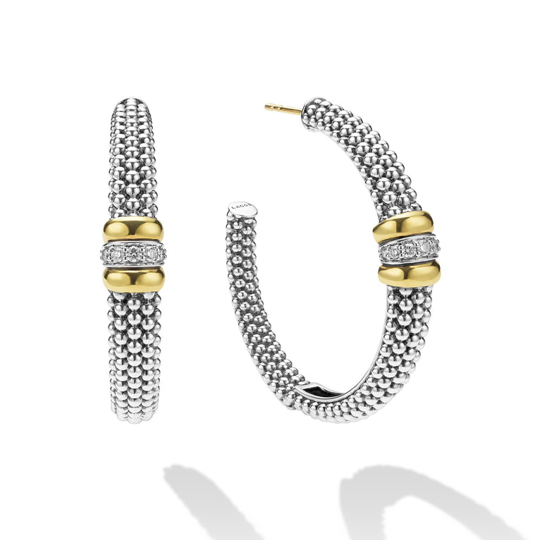 side of large sterling silver beaded hoop earrings with gold and diamond accents