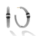 side of large sterling silver beaded hoop earrings with black ceramic and diamond details