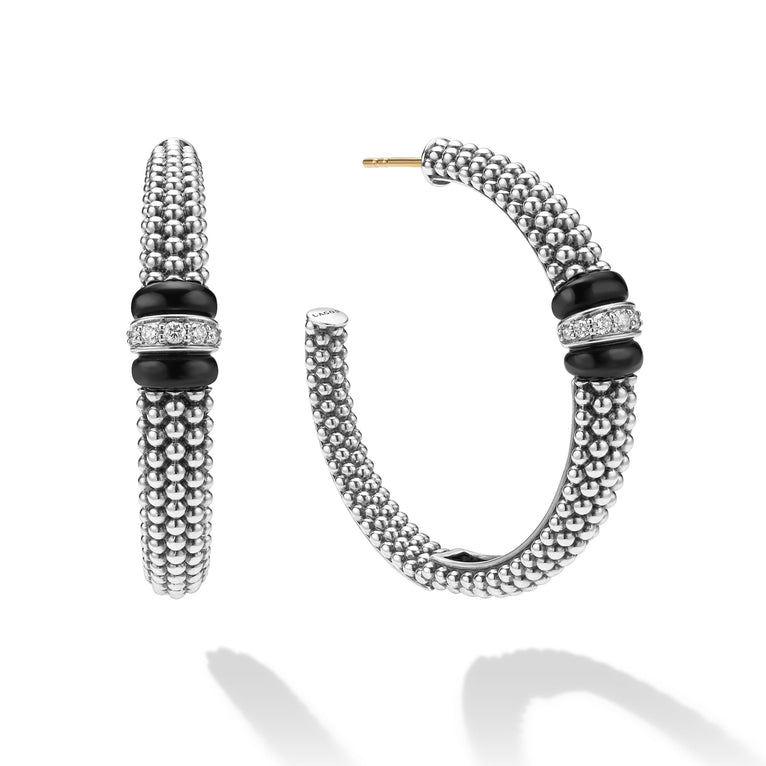 side of large sterling silver beaded hoop earrings with black ceramic and diamond details