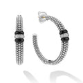 side of large sterling silver beaded hoop earrings with black ceramic and diamond details