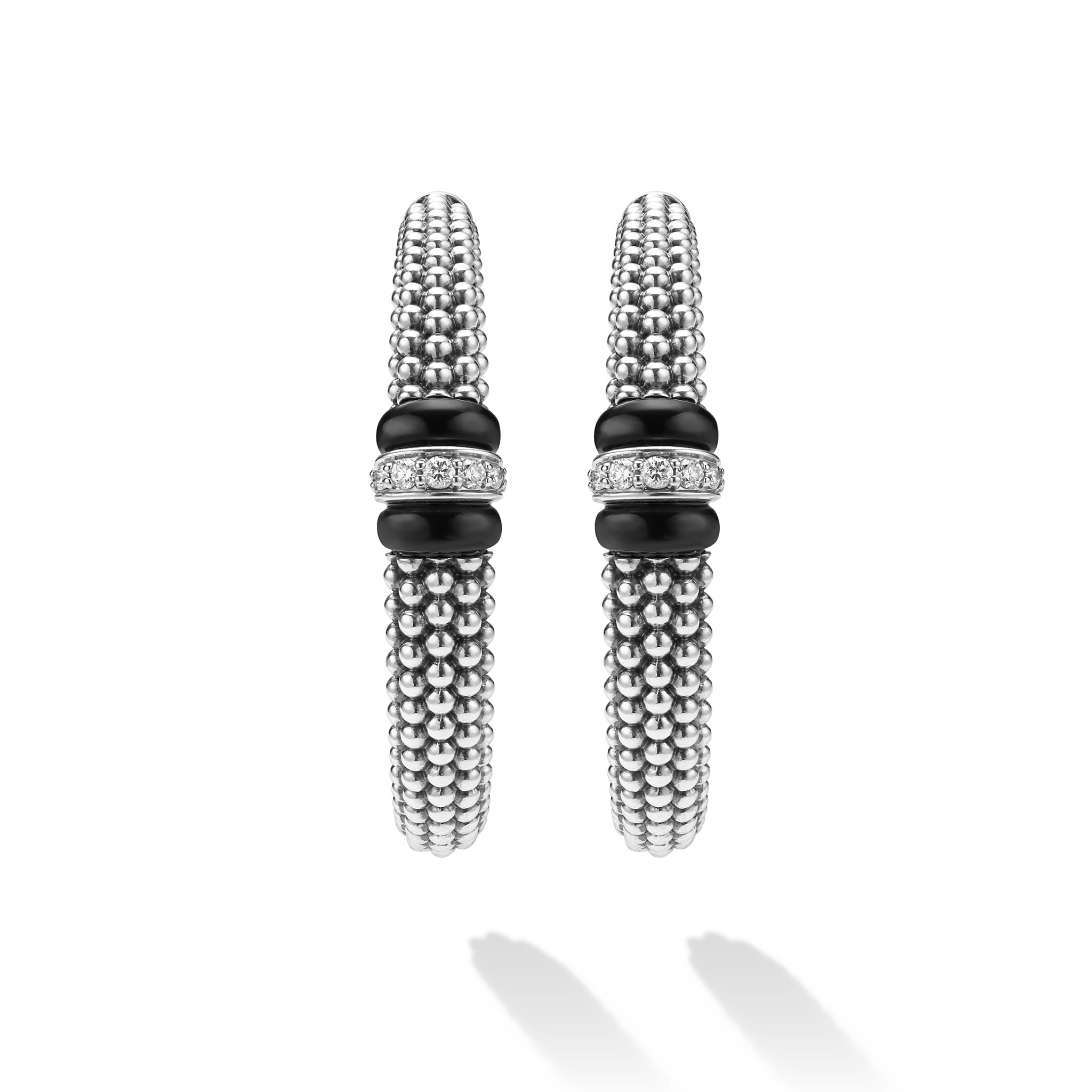 front of large sterling silver beaded hoop earrings with black ceramic and diamond details