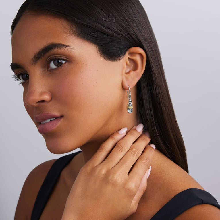 woman wearing sterling silver and gold beaded teardrop earrings with french wire