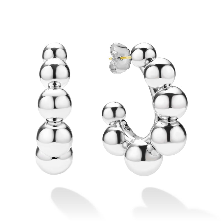 side of large beaded sterling silver hoop earrings