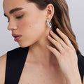 woman wearing beaded sterling silver hoop earrings