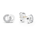Signature Caviar Silver Interlocking Diamond Stud Earrings featuring polished silver-tone circles with clear stones, gold-colored posts, and butterfly backings, embody timeless elegance and refined craftsmanship.