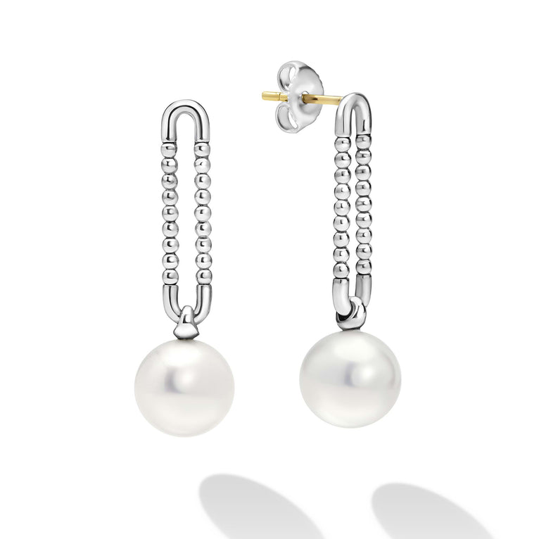 Luna Sterling Silver Pearl Drop Earrings feature U-shaped tops with silver bead strands ending in lustrous pearls, blending modern design with timeless elegance.