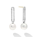 Luna Sterling Silver Pearl Drop Earrings feature silver U-shaped tops with beaded chains and elegant white pearls, showcasing LAGOS modern design and timeless elegance.