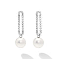 Luna Sterling Silver Pearl Drop Earrings feature U-shaped loops with strands of silver beads ending in lustrous pearls, showcasing LAGOS' elegance and craftsmanship.