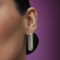 woman wearing large sized everyday gold beaded with sterling silver hoop earrings 