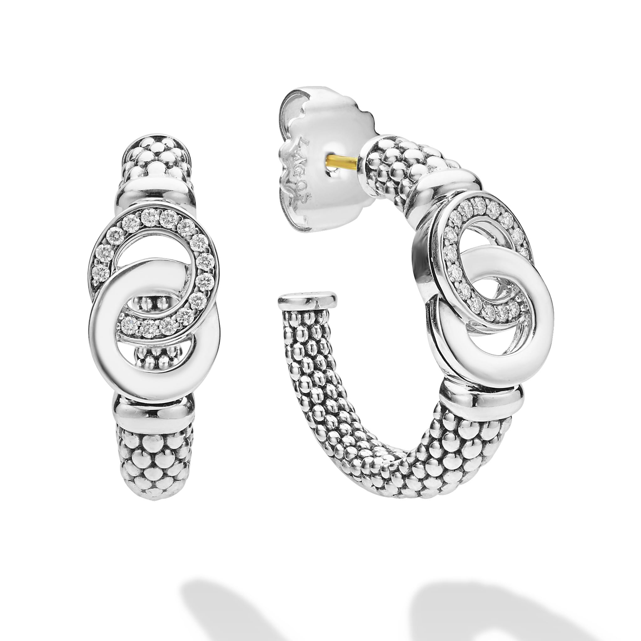 Signature Caviar Silver Interlocking Diamond Hoop Earring featuring sterling silver oval links, pavé-set diamonds, gold-tone post, and butterfly clutch backing, showcasing LAGOS elegant craftsmanship.
