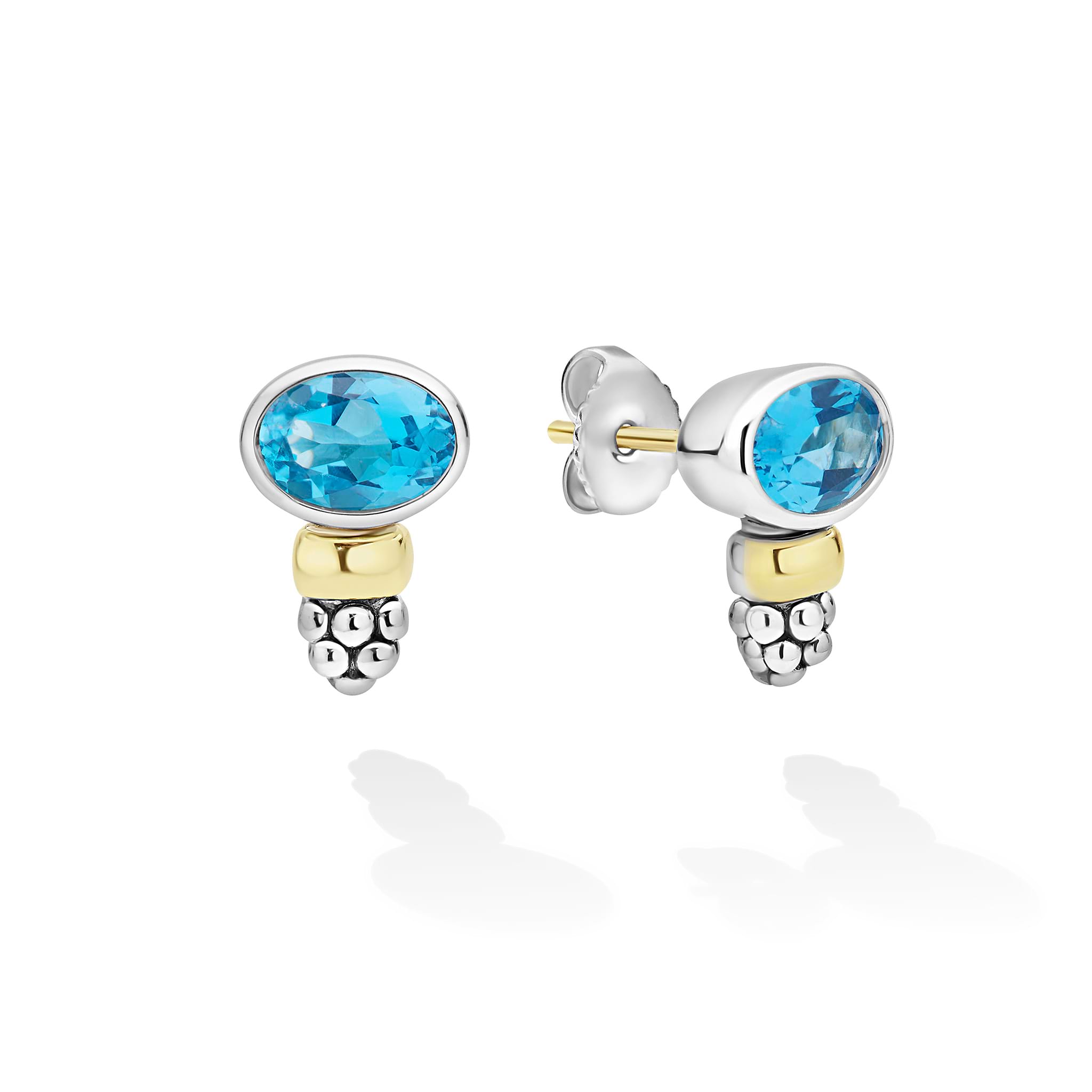 Signature Caviar Two-Tone Swiss Blue Topaz Oval Earrings feature bezel-set gemstones in silver frames with gold links and silver bead clusters, embodying LAGOS elegance.