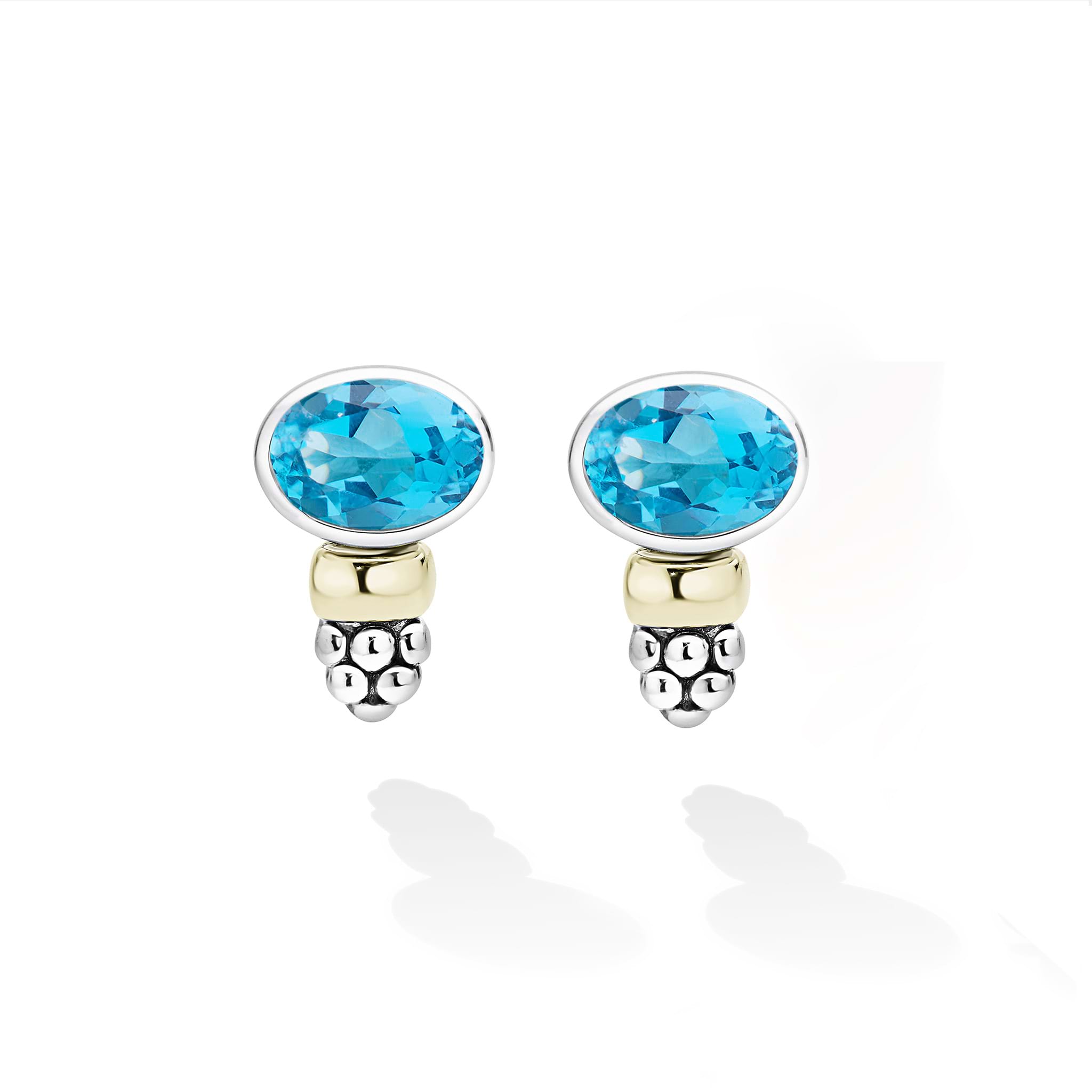 Signature Caviar Two-Tone Swiss Blue Topaz Oval Stud Earrings with sterling silver, 14K gold accents, and caviar beading, showcasing vibrant Swiss blue topaz gemstones.